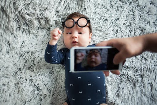 Photo of baby wearing glasses