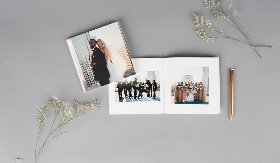 Anniversary photo book with flowers and gold pen 